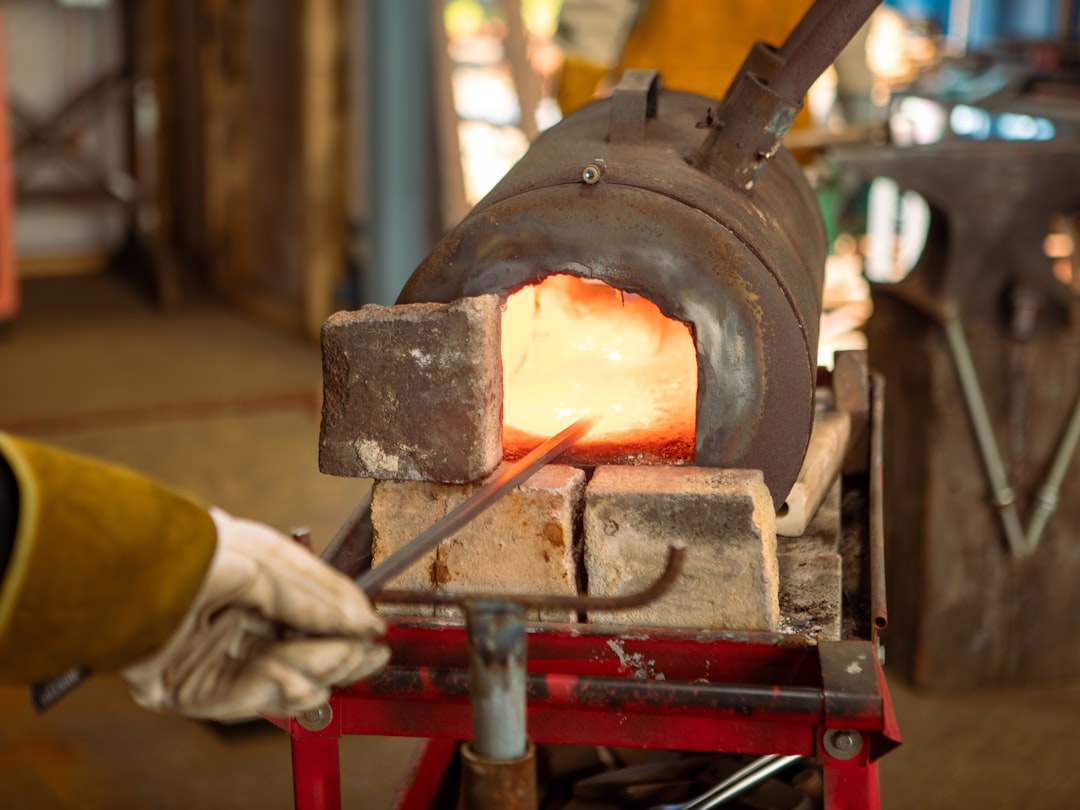 blacksmith-heating-metal-in-a-forge-9ex7ilxnbce